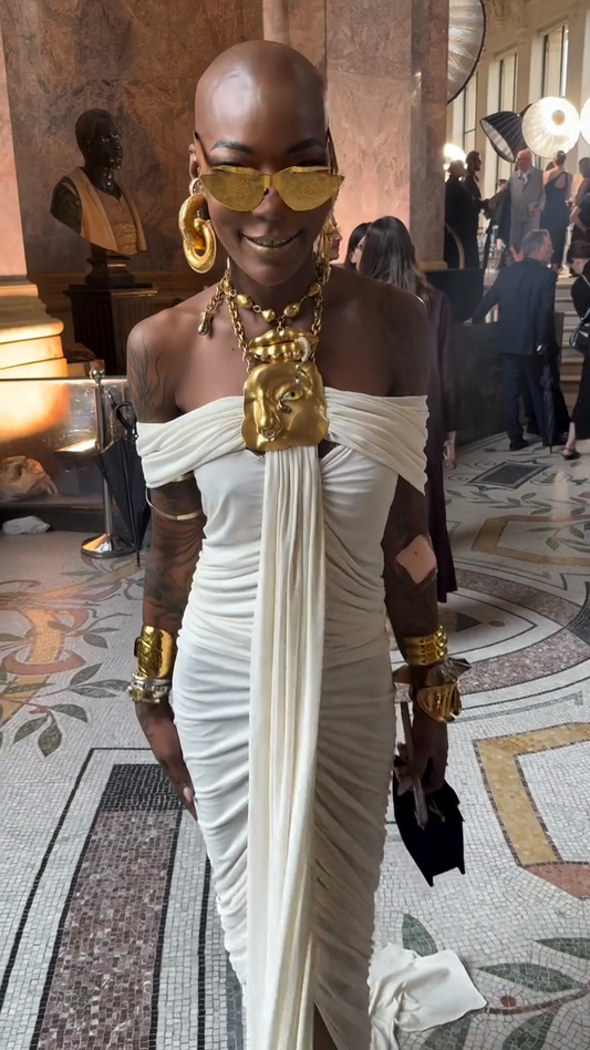 White off-the-shoulder draped gown